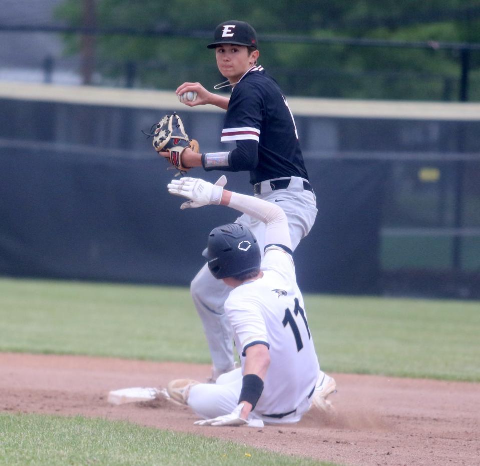 Elmira second baseman Ashtyn Traugott-Knoll throws to first after forcing out Corning's Carter Rosno during the Express' 6-0 win in Game 2 of the Section 4 Class AA baseball finals May 24, 2023, sweeping the best-of-three-series.