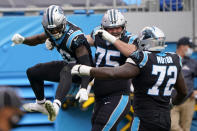 Carolina Panthers wide receiver Curtis Samuel, left, celebrates after scoring with Michael Schofield and Taylor Moton during the second half of an NFL football game against the Detroit Lions Sunday, Nov. 22, 2020, in Charlotte, N.C. (AP Photo/Brian Blanco)