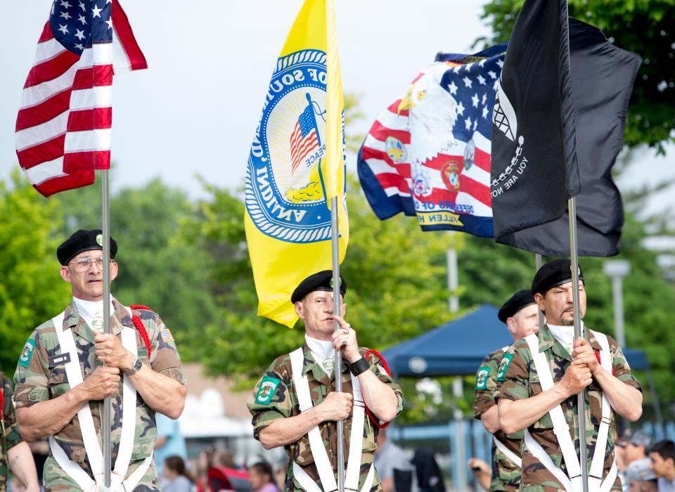 Miller's Vets, a drill team comprised of homeless veterans, marches in the South Bend West Side Memorial Day Parade in 2015.