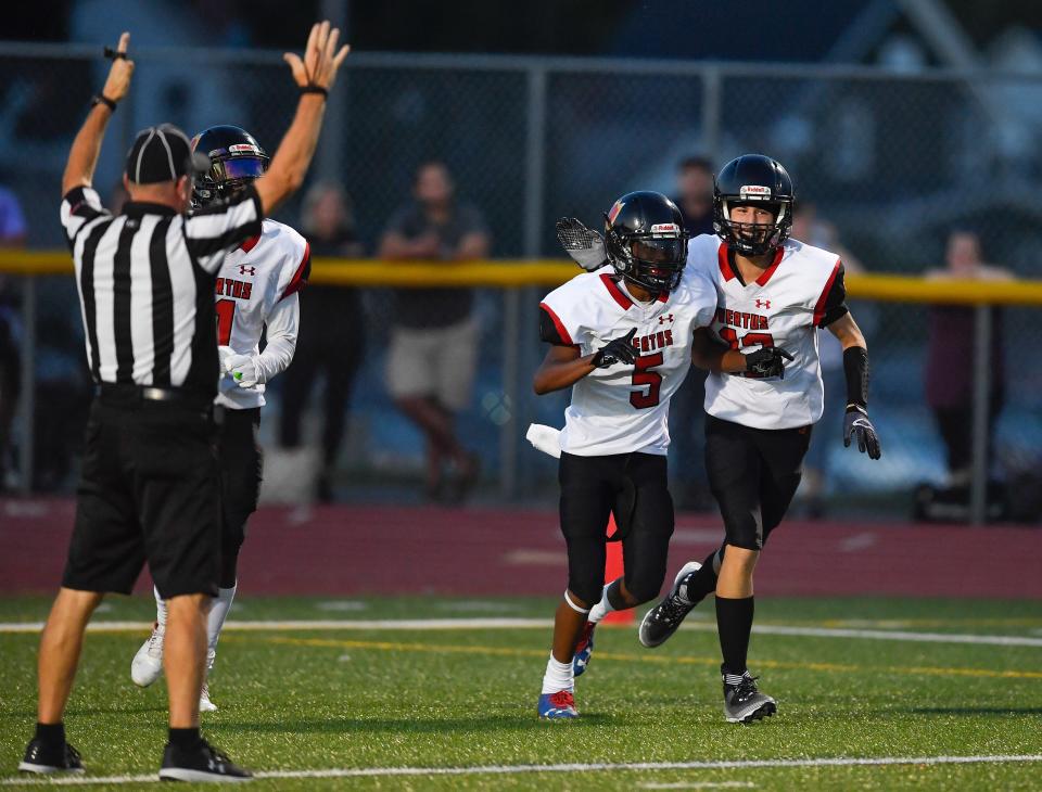 Vertus' E'mere Fulton (5) celebrates with Adrian Santiago after scoring against ER/Gananda during a regular season game at East Rochester High School, Saturday, Sept. 3, 2022.