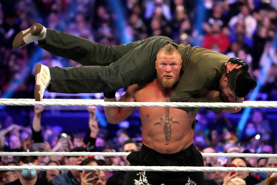 Brock Lesnar and Bad Bunny battle during the Royal Rumble match Jan. 29, 2022 in St. Louis, Missouri during the Royal Rumble at The Dome at America's Center.