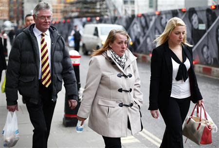 Family members of British soldier Drummer Lee Rigby leave during a lunch break in the trial of his suspected murderers at the Old Bailey in central London December 3, 2013. REUTERS/Andrew Winning