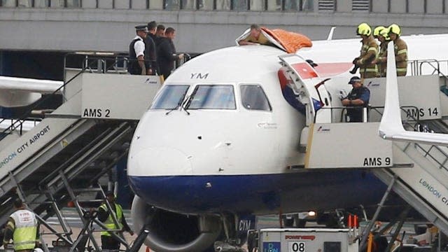 James Brown, 56, on top of a plane on the morning of October 10 2019 during a protest against flying at London City Airport