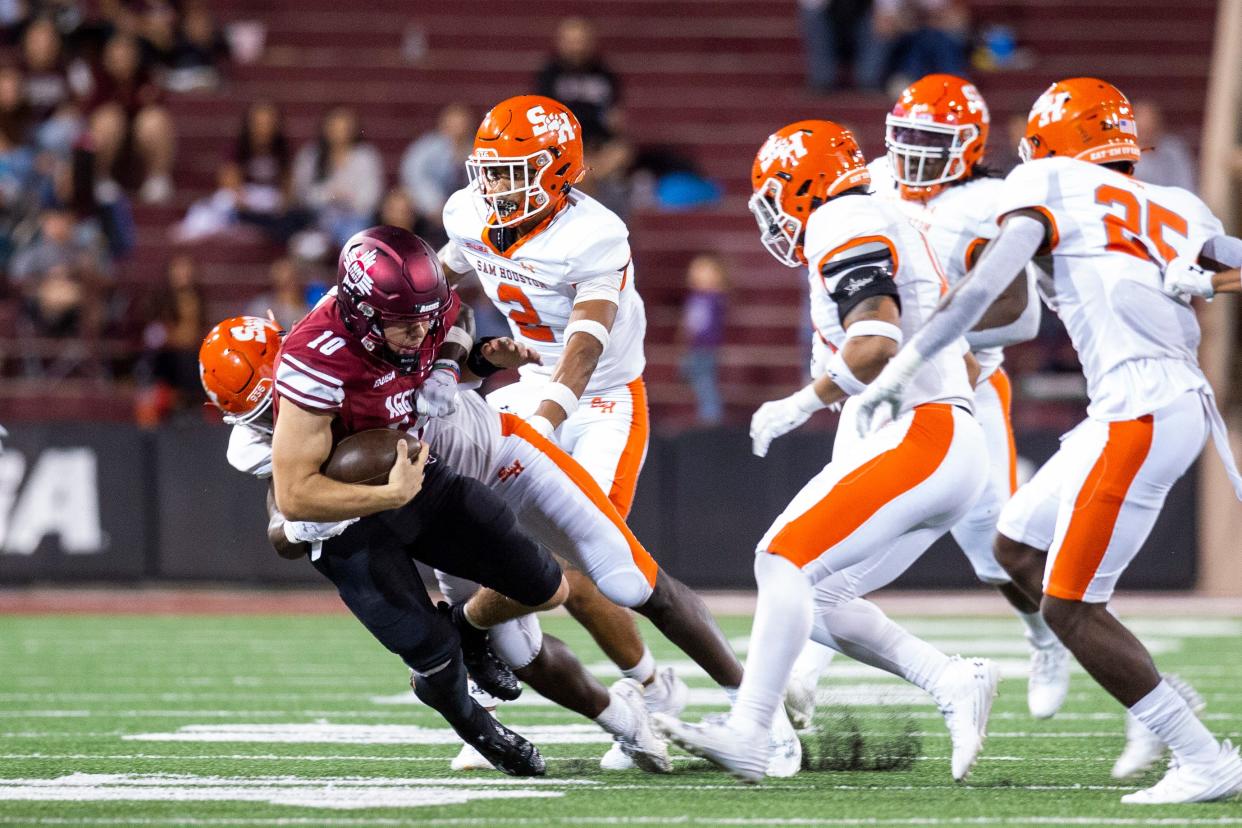 Aggie quarterback Diego Pavia runs the ball during a NMSU football game on Wednesday, Oct. 11, 2023, at the Aggies Memorial Stadium.