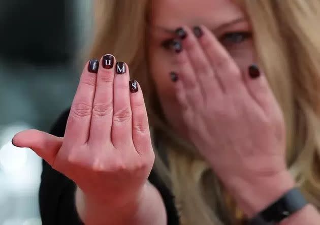 Applegate shows off her manicure.