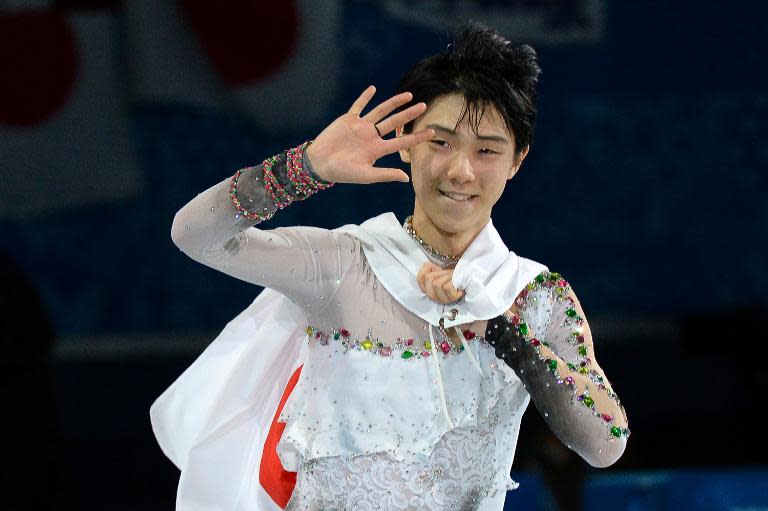 Japan's Yuzuru Hanyu celebrates after the Men's Figure Skating Free Program at the Iceberg Skating Palace during the Sochi Winter Olympics on February 14, 2014
