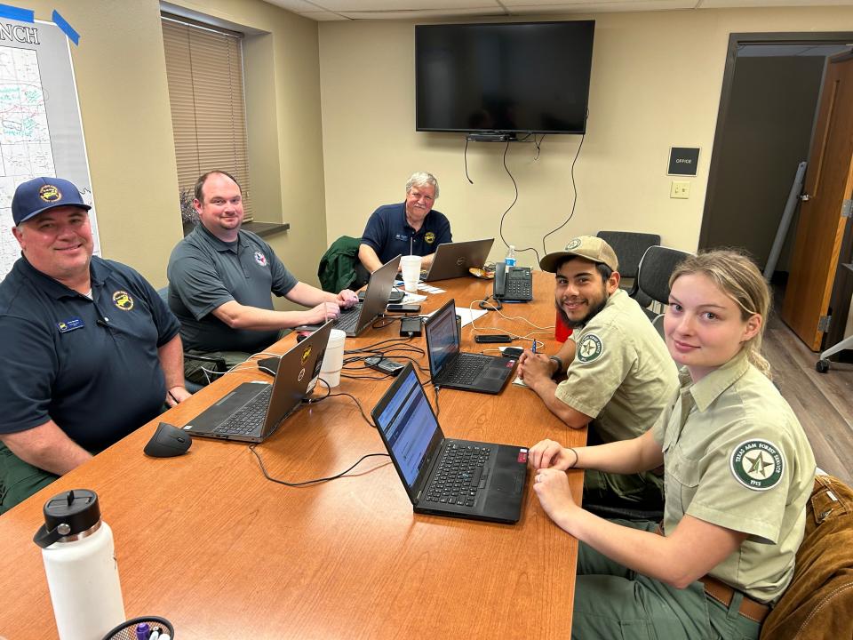 Behind the scenes firefighting efforts are coordinated with federal, state and local entities. From left are Steve Balkerus, Trey Baxter, of the Texas A&M All Hazard Incident Team; Terry Krasko, alternate lead on the Blue Team; Juan Rodriguez, Texas A&M Forest Service; and trainee Jessie Inderman.
