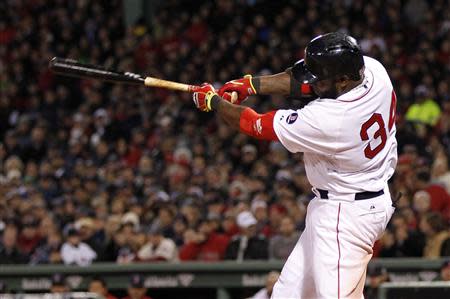 Oct 23, 2013; Boston, MA, USA; Boston Red Sox designated hitter David Ortiz (34) hits a 2-run home run against the St. Louis Cardinals during the seventh inning of game one of the MLB baseball World Series at Fenway Park. Greg M. Cooper-USA TODAY Sports