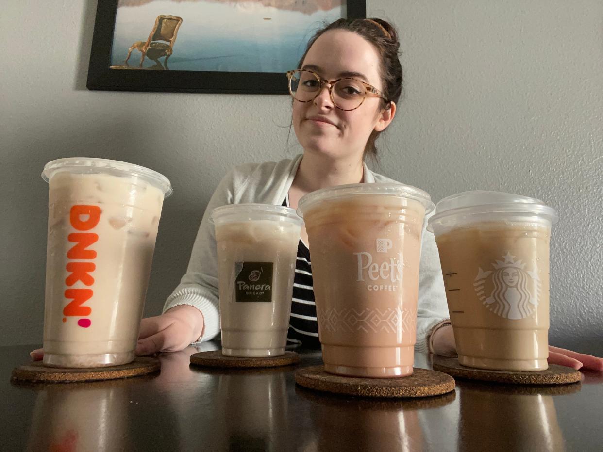 Paige Bennet at a table with four iced chai lattes.