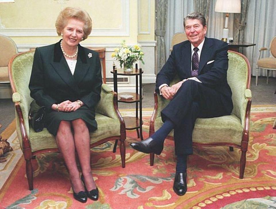1990 Former Prime Minister Margaret Thatcher with former US President Ronald Reagan at Claridges, in London. (PA)