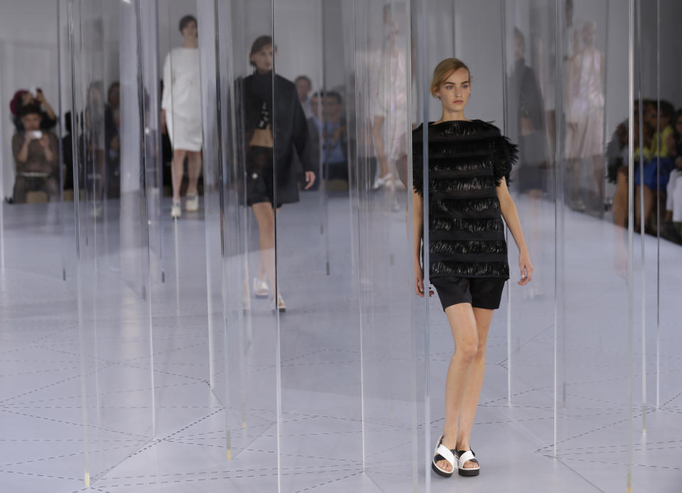 Models wear creation for Jil Sander women's Spring-Summer 2014 collection, part of the Milan Fashion Week, unveiled in Milan, Italy, Saturday, Sept. 21, 2013. (AP Photo/Luca Bruno)