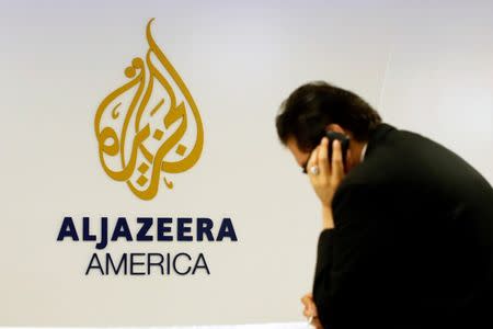 A man works at a desk in the Al Jazeera America broadcast center in New York, August 20, 2013. REUTERS/Brendan McDermid