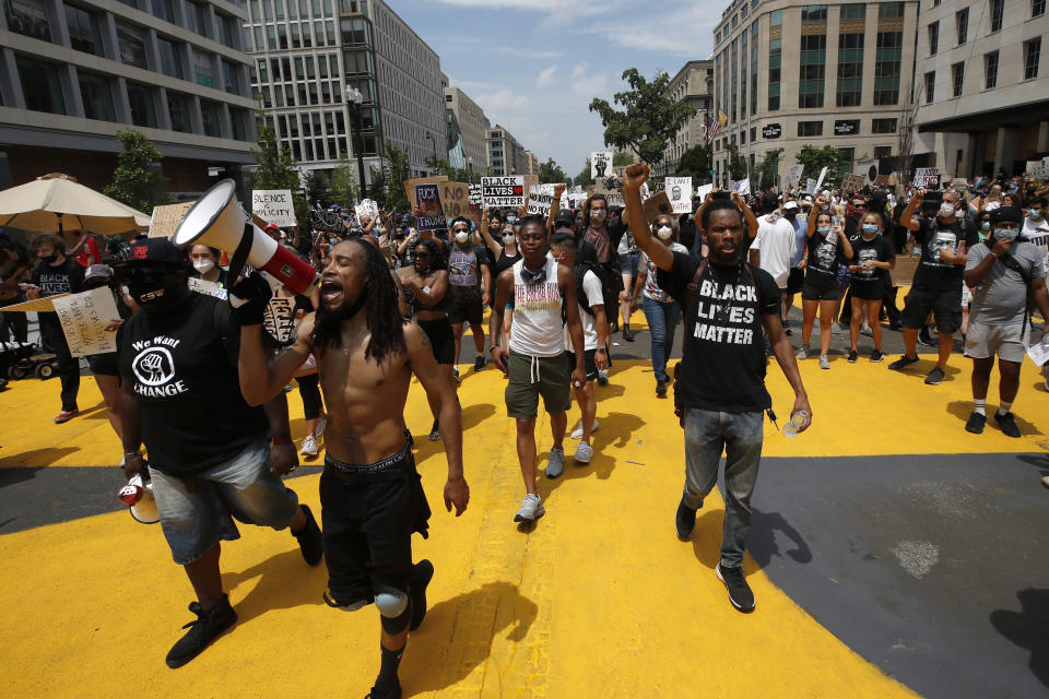 FILE - In this June 6, 2020, file photo, demonstrators protest near the White House in Washington over the death of George Floyd, a black man who was in police custody in Minneapolis. In just about any other year, Juneteenth, the holiday celebrating the day in 1865 that all enslaved black people learned they had been freed from bondage, would be marked with a cookout, a parade, or a community festival. But Juneteenth 2020 will be a day of protest in may places Friday, June 19. (AP Photo/Alex Brandon, File)