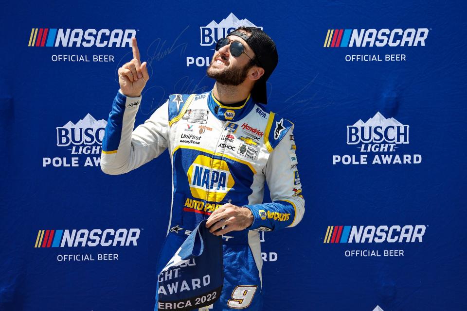 Defending race winner Chase Elliott poses for photos after winning the pole for Sunday's Kwik Trip 250 at Road America.