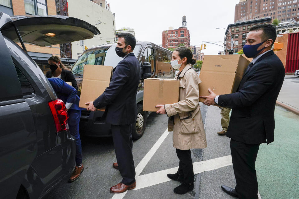 Federal agents remove boxes of evidence from the building that houses the Sergeants Benevolent Association offices, Tuesday, Oct. 5, 2021, in New York. Federal agents raided the offices of the New York City police union whose leader has clashed with city officials over his incendiary tweets and hard-line tactics. They also raided the Long Island home of Sergeants Benevolent Association president Ed Mullins. (AP Photo/Mary Altaffer)