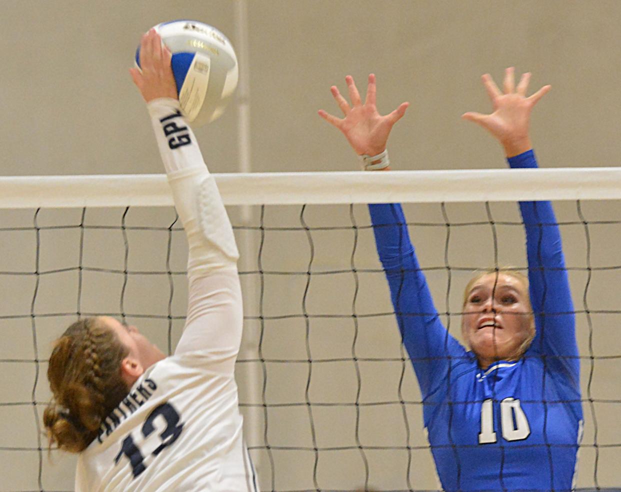 Great Plains Lutheran's Esta Cameron spikes the ball against Florence-Henry's Caylin Kelly during their Eastern Coteau Conference volleyball match on Thursday, Aug. 24, 2023 in Watertown.