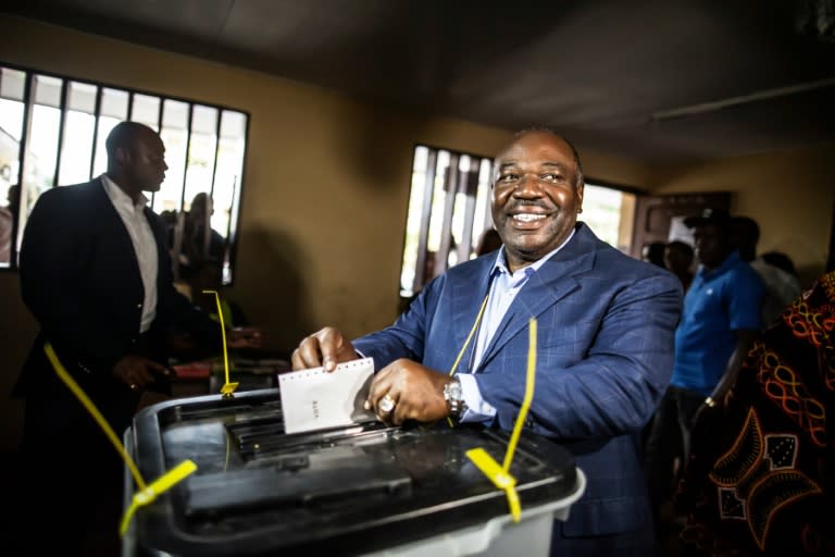 Gabonese President Ali Bongo Ondimba arrives to cast his vote at a polling station in Libreville