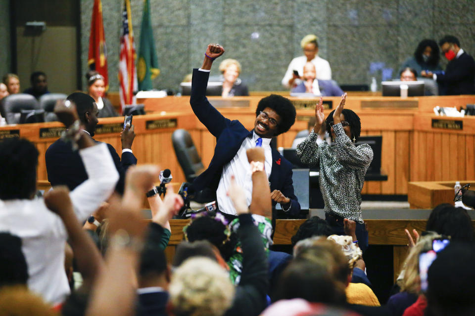 FILE - Justin Pearson celebrates with supporters after being reinstated to the Tennessee House of Representatives by the Shelby County Board of Commissioners building in Memphis, Tenn., on Wednesday, April 12, 2023. Two young Black Tennessee state legislator two young Black Tennessee state legislatorJustin Pearson and Justin Jones — now widely known simply as "the Justins" — were expelled by the overwhelmingly white, Republican-controlled state Legislature and then reinstated by local officials days later. They are being heralded as living echoes of the civil rights struggles of the 1960s, when leaders like the Rev. Martin Luther King Jr., John Lewis and A. Philip Randolph organized protests across the American South. (Chris Day/The Commercial Appeal via AP, File)