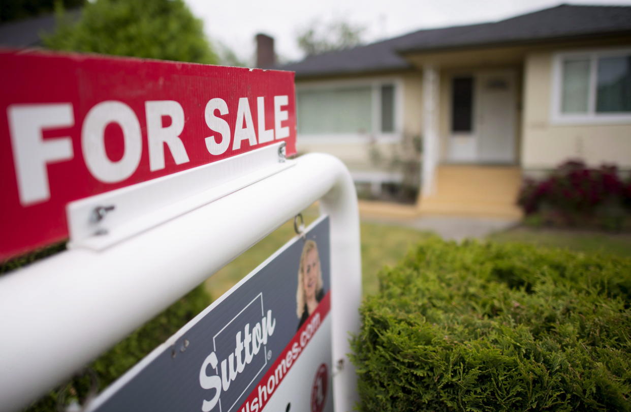 A real estate sign is pictured in Vancouver on June 12, 2018. (Canadian Press)