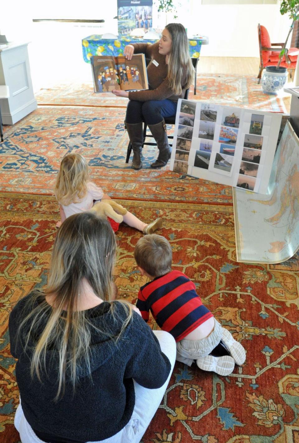 Hingham Historical Society visitor services manager Margaret Sebestyen reads the story of the Mayflower during the society's Colonial Story Time at the society's museum.