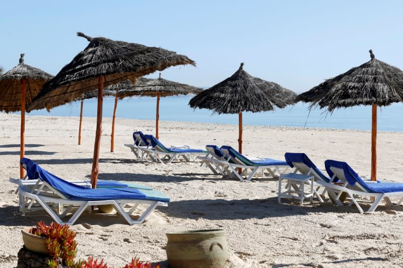 FILE PHOTO: Empty sunbathing chairs are seen on a beach near the Hasdrubal Hotel in Hammamet