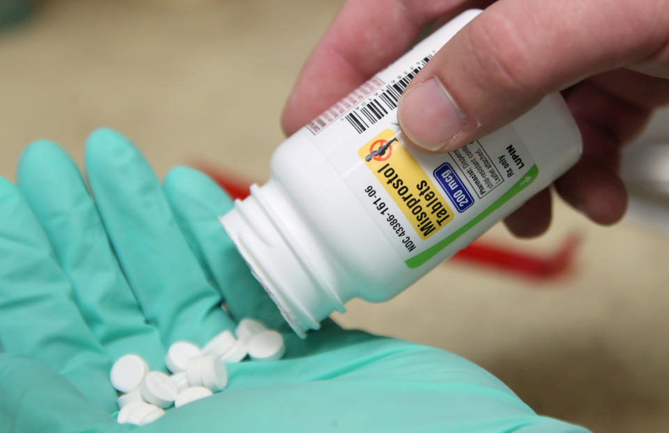 A pharmacist poses with pills of the drug Misoprostol, made by Lupin Pharmaceuticals, in his hand at a pharmacy in Provo, Utah, U.S., June 19, 2019. Picture taken June 19, 2019.  REUTERS/George Frey