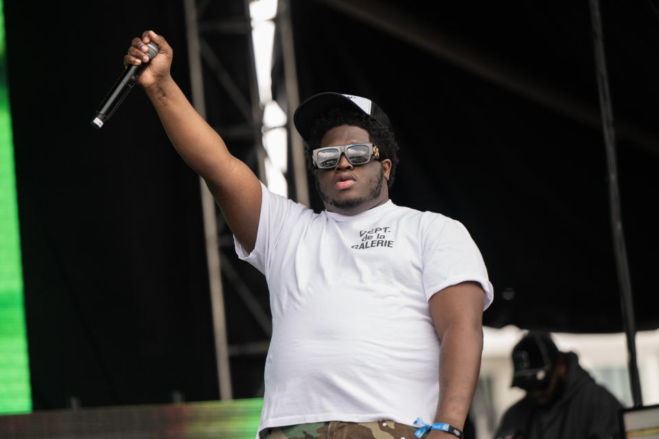 Cash Cobsain performing at Rolling Loud LA, wearing a white t-shirt and Black and white hat.