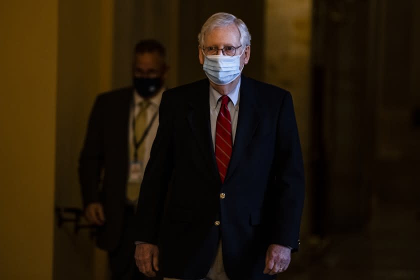 WASHINGTON, DC - DECEMBER 20: Senate Majority Leader Mitch McConnell (R-KY) heads to the floor of the Senate from his office on December 20, 2020 in Washington, DC. Republicans and Democrats in the Senate finally came to an agreement on the coronavirus relief bill and a vote is expected later today. (Photo by Samuel Corum/Getty Images)