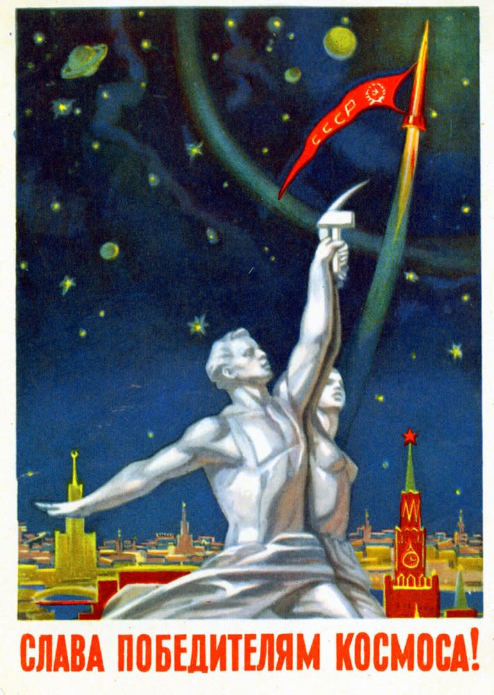 Symbols of the Soviet Union, a proletarian man raising a hammer and a peasant woman raising a sickle, are placed against the Moscow skyline at night. The motto reads, "Glory to the conquerors of the cosmos!"