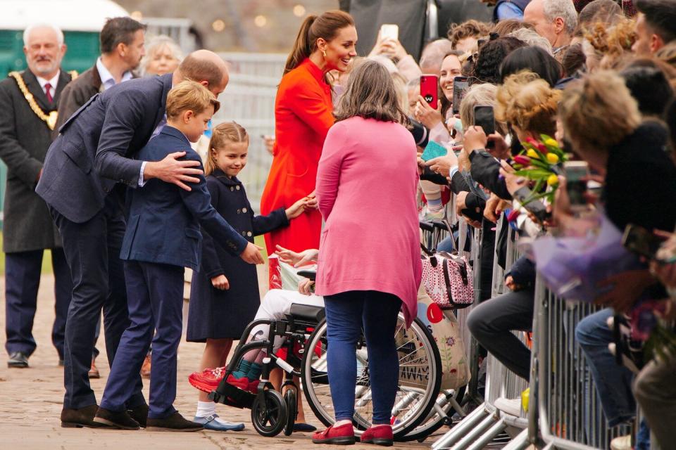 The Duke and Duchess of Cambridge, Prince George and Princess Charlotte speak to wellwishers during their visit to Cardiff Castle