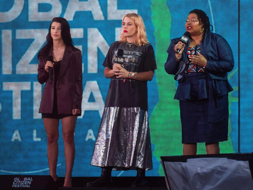 Phoebe Gates, Busy Philipps, and Tlaleng Mofokeng speak on stage at the Global Citizen Festival 2023