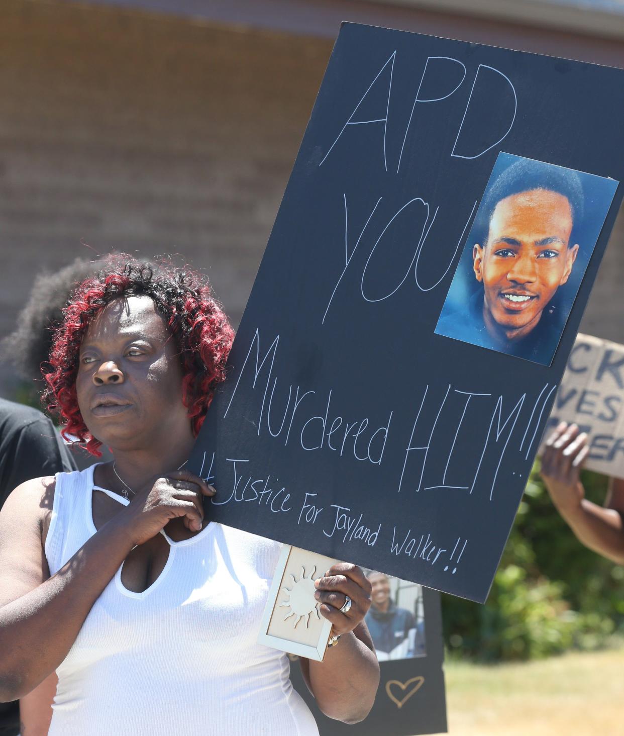 Lynnette Williams holds a sign during a gathering at Second Baptist Church on Saturday, July 2, 2022, in Akron, Ohio, calling for justice for Jayland Walker after he was fatally shot by Akron Police. 