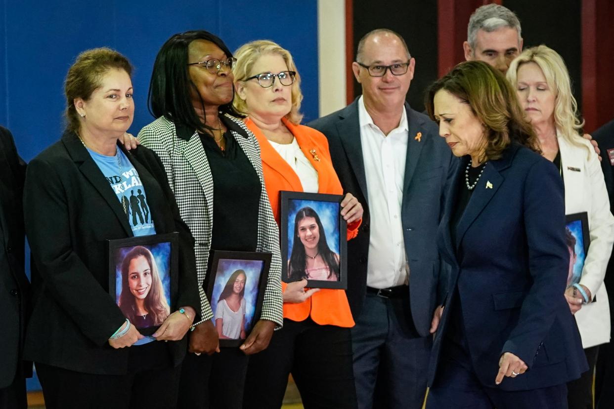 Family members hold portraits of the victims of the 2018 shooting at Marjory Stoneman Douglas High School (AFP via Getty Images)