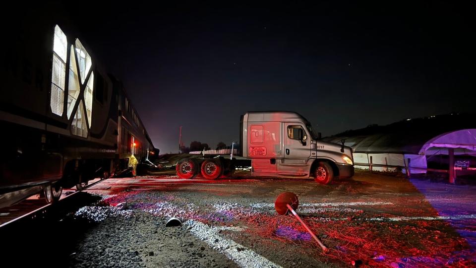 The tractor of a semitrailer hit by a train in the Somis area Tuesday night rests near the tracks along Highway 118 at Sand Canyon Road. The driver was apparently not injured.