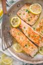 <p>Not everyone eats meat, so a turkey won’t cut it for vegans and pesctetarians. Fortunately, this lemon garlic salmon from <a href="https://40aprons.com/lemon-garlic-salmon-whole30/" rel="nofollow noopener" target="_blank" data-ylk="slk:40 Aprons;elm:context_link;itc:0;sec:content-canvas" class="link ">40 Aprons</a> is an excellent option for those looking to have more fish in the diet. It's ready in 25 minutes, too, which is super fast!</p>