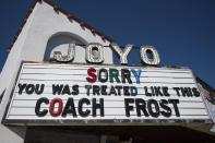 A sign board displays a sympathetic message to former Nebraska head coach Scott Frost outside Joyo Theater in Lincoln, Neb on Monday, Sept. 12, 2022. The sign references the firing of Nebraska head coach Scott Frost on Sept. 11, 2022. (Noah Riffe/Lincoln Journal Star via AP)