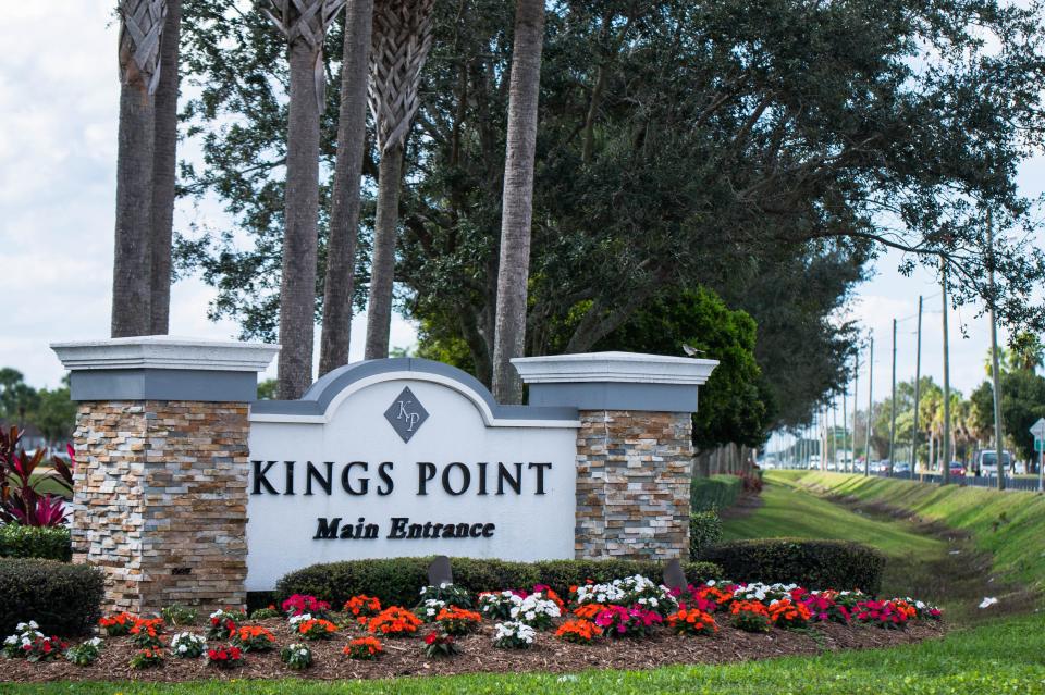 Signage indicating the entrance to the main Kings Point clubhouse is seen along West Atlantic Avenue on Thursday west of Delray Beach.