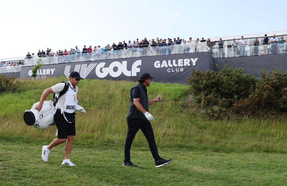 Phil Mickelson acknowledges spectators in the gallery during the third round of the inaugural LIV golf invitational golf tournament at the Centurion Club outside of London. Mandatory Credit: Paul Childs-Action Images/Reuters via USA TODAY Sports