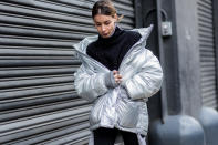 <p>If you’re going to get one puffer coat this year, get a metallic silver one, especially if you enjoy wearing all black in everything else. Wear it low on your shoulders, in a style popularized by Balenciaga. (Photo: Getty) </p>