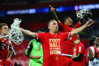 Franck Ribery of Bayern Muenchen celebrates with a piece of goal netting after winning the UEFA Champions League final.