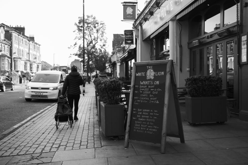 Pub sign in London in black and white