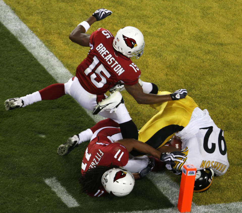 Pittsburgh's James Harrison runs a 100-yard interception for a touchdown to score as time ran out in the first half as the Pittsburgh Steelers face the Arizona Cardinals in Super Bowl XLIII at Raymond James Stadium in Tampa, Florida, Sunday, February 1, 2009.  (Photo by Terry Gilliam/MCT/Tribune News Service via Getty Images)