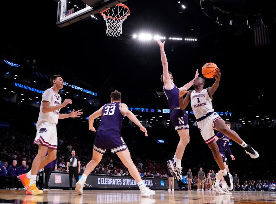 March 22, 2024, Brooklyn, NY, USA; Florida Atlantic Owls guard Johnell Davis (1) shoots against Northwestern Wildcats guard Brooks Barnhizer (13) in the first round of the 2024 NCAA Tournament at the Barclays Center. Mandatory Credit: Robert Deutsch-USA TODAY Sports