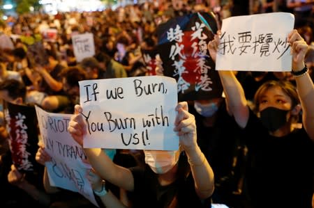 Anti-extradition bill protesters attend a rally calling on the British and U.S. governments to monitor the implementation of "one country two systems" principal, in Hong Kong