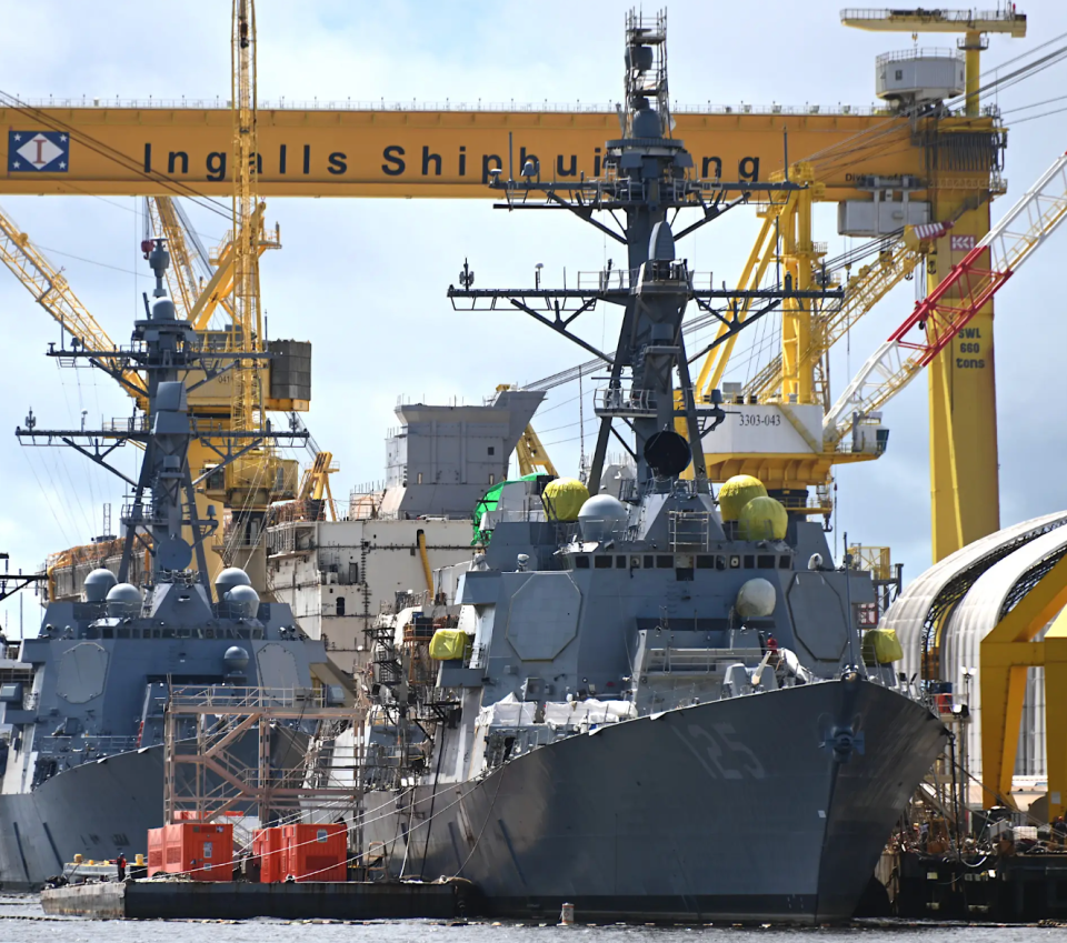 The future USS <em>Jack H. Lucas</em> being fitted out in Pascagoula, Mississippi in August 2022. The future USS <em>Lenah H. Sutcliffe Higbee</em>, a Flight IIA <em>Arleigh Burke</em> class destroyer, is directly behind, offering a good comparison between the fixed-face antennas for the new AN/SPY-6(V)1 radar and those for the older AN/SPY-1D fitted to earlier ships of this class. Neither vessel has SEWIP Block III installed. <em>Chris Cavas photo</em> <br>