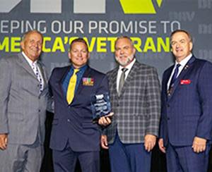 WPS Military and Veteran Inclusion Lead Tim La Sage, second from left, receives the DAV 2022 Large Employer of the Year award from DAV officials.
