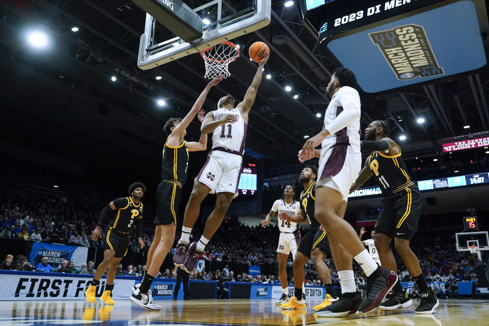 Mississippi State's Eric Reed Jr. (11) puts shoots against Pittsburgh's Guillermo Diaz Graham, front left, during the first half of a First Four game in the NCAA men's college basketball tournament Tuesday, March 14, 2023, in Dayton, Ohio. (AP Photo/Darron Cummings)