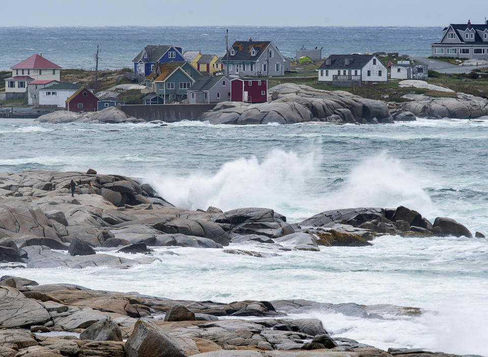 Waves batter the shore in Peggy's Cove, N.S., on Wednesday, Sept. 23, 2020. Hurricane Teddy has impacted the Atlantic region as a post-tropical storm, bringing rain, wind and high waves. (Andrew Vaughan/The Canadian Press via AP)
