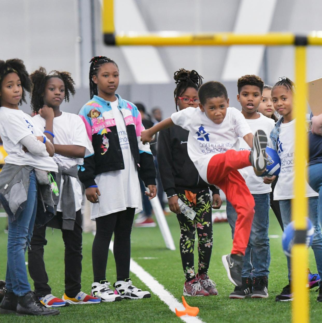 David Ross, 7, tries a field goal kick after "buying" insurance that will allow him another kick if he misses during the Money Matters: Financial Field Day event on the Daily's Place Flex Field Wednesday, February 26, 2020 in Jacksonville, Florida. The event, hosted by TIAA Bank, EverFi and Communities In Schools, was attended by about 100 students from Carter G. Woodson, S.A. Hull, Woodland Acres and Andrew Robinson Elementary schools.