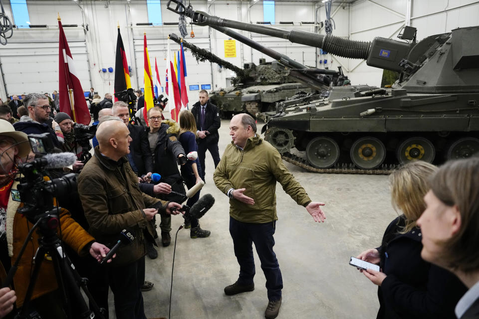 Britain's Defence Secretary Ben Wallace speaks to the media during his visit to the Tapa Military Camp, in Estonia, Thursday, Jan. 19, 2023. Wallace said his country would send at least three batteries of AS-90 artillery, armoured vehicles, thousands of rounds of ammunition and 600 Brimstone missiles, as well as the squadron of Challenger 2 tanks. (AP Photo/Pavel Golovkin)